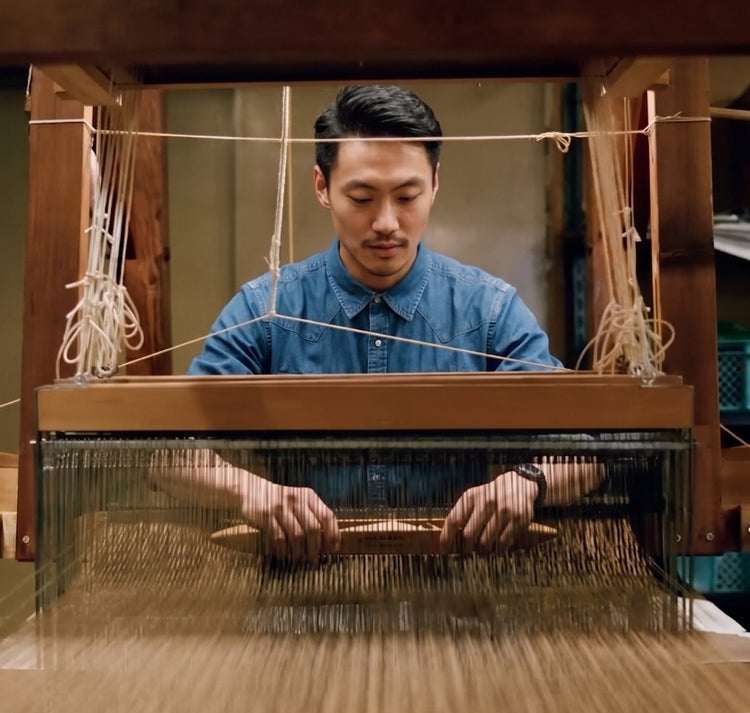 picture of founder leo wang second generation weaver  at a weaving mill